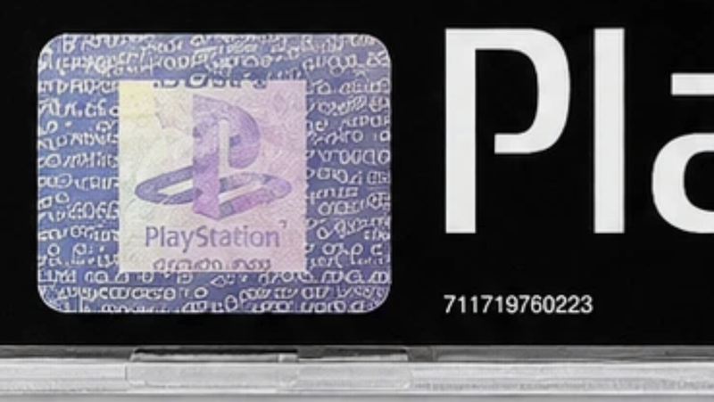 An AI-edited listing photo of a PlayStation hologram. The background text has been replaced with an indistinct pattern of glyphs.