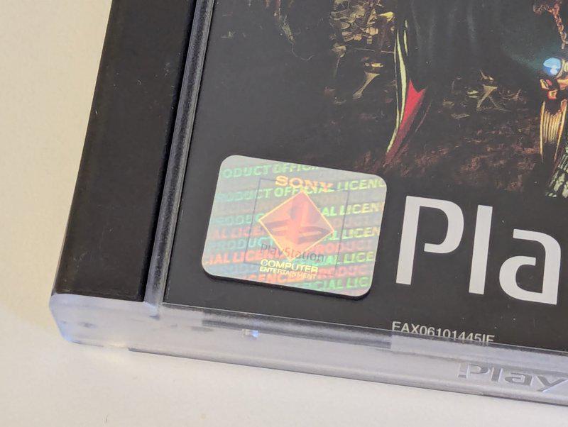 Close-up of PlayStation hologram in bottom left corner of case.
