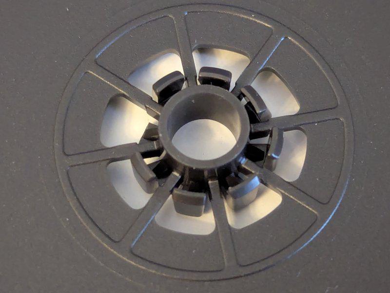 Example of damaged disc spindle teeth on the small black bordered cases.