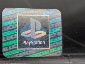 The first hologram design on a PS1 case, showing the SCE logo