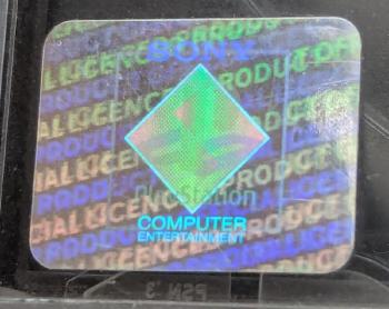 The first hologram design on a PS1 case, showing the PlayStation logo at a different angle
