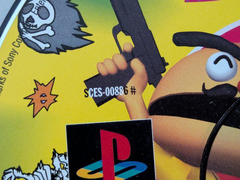 The Point Black SCES code on disk where 'S' and '6 #' are in black lettering on a lighter background and 'CES-0088' are in white lettering on a dark background.