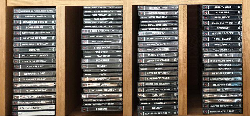 A collection of PS1 games arranged on a shelf.