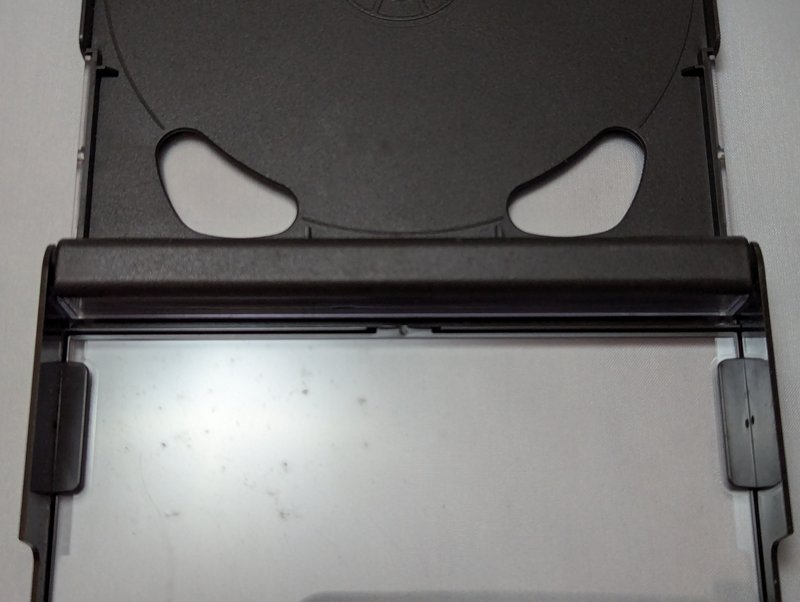 Open case viewed from above showing the hinge band running across the centre where the tray meets the front leaf.