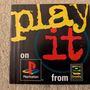 Gremlin PWEI Play It Yellow text Black leaflet